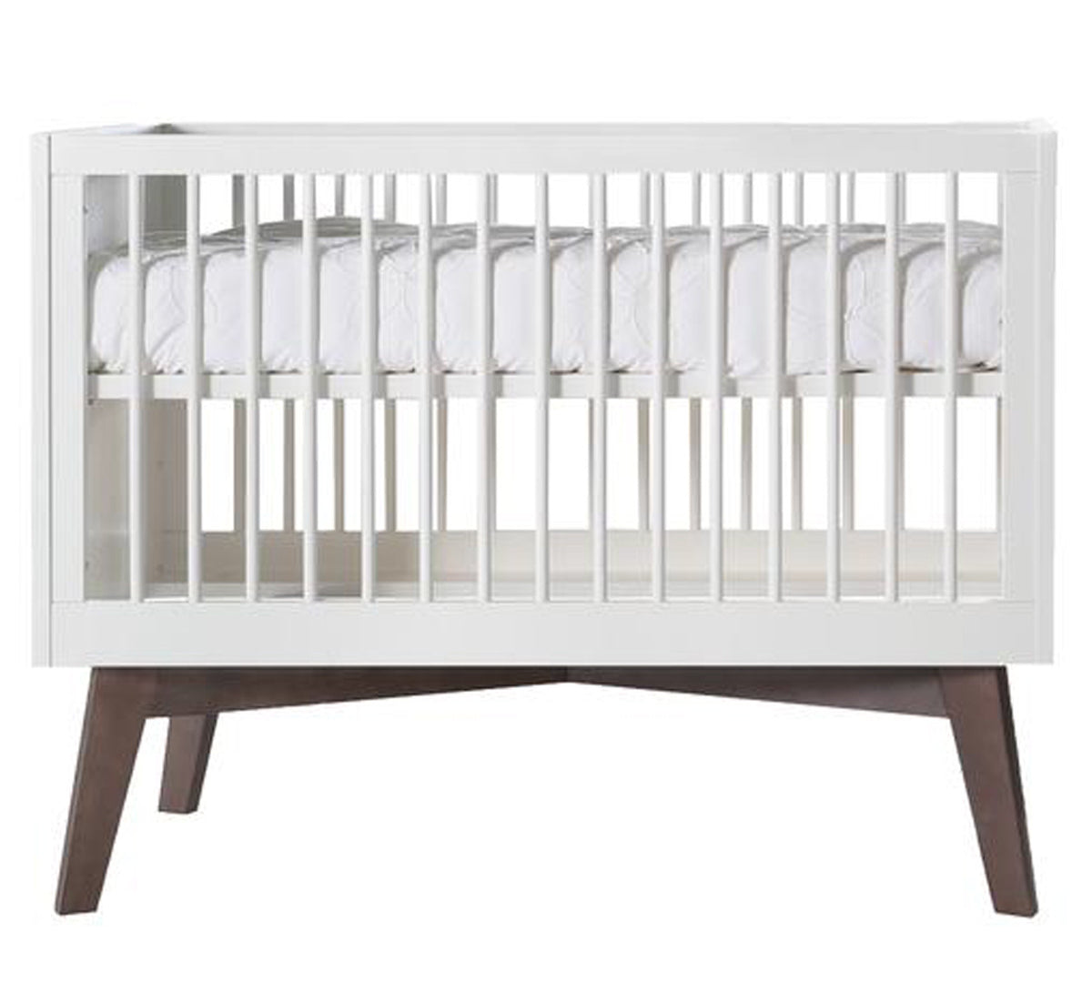 Deer Industries Baby Bed Nursery furniture Sixties matte white in combination with a dark wooden base. Cot and cot bed with standard European mattress size 60x120 or 70x140. Made in Europe complies with all European safety regulations. Stylish baby crib contemporary but a bit retro. Gender neutral for baby boy and baby girl and for toddler as the beds are convertible in both sizes.