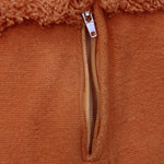 A large, orange, carrot-shaped bean bag with a green leaf on top, made of cotton fabric, kids bean bags and poufs singapore