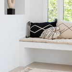 A beige and black geometric patterned washable rug with tassels on the border, kids rugs singapore