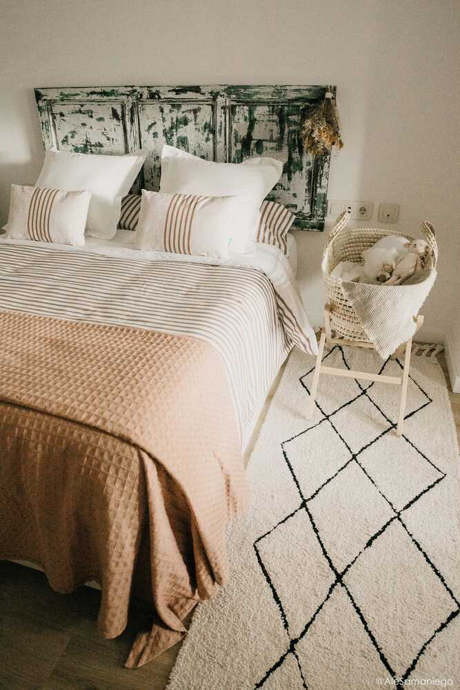 A beige and black geometric patterned washable rug with tassels on the border, kids rugs singapore