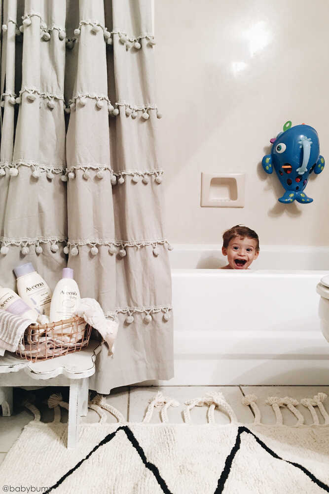 A beige and black geometric patterned washable rug with tassels on the border, kids rugs singapore