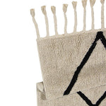 A beige and black geometric patterned washable rug with tassels on the border, kids rugs singapore