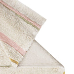 A rectangular, flatweave washable rug in beige, pink, and gray tones with a minimalistic geometric pattern, kids rugs and carpets singapore