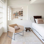 A rectangular, flatweave washable rug in beige, pink, and gray tones with a minimalistic geometric pattern, kids rugs and carpets singapore