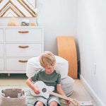 A round pearl grey pouf made of cotton, with a textured surface, kids bean bags and poufs Singapore