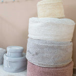 A round pearl grey pouf made of cotton, with a textured surface, kids bean bags and poufs Singapore