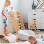 A round pearl grey pouf made of cotton, with a textured surface, kids bean bags and poufs Singapore