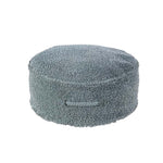 A round vintage blue pouf made of cotton, with a textured surface and a visible carrying handle, kids bean bags and poufs in Singapore