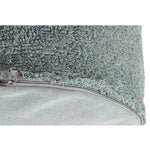 A round vintage blue pouf made of cotton, with a textured surface and a visible carrying handle, kids bean bags and poufs in Singapore