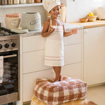 A square-shaped pouf with a brown and white checkered pattern, designed for children's rooms, kids bean bags and poufs Singapore