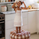 A square-shaped pouf with a brown and white checkered pattern, designed for children's rooms, kids bean bags and poufs Singapore