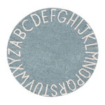 A round blue rug with the letters of the alphabet in white arranged around the edge. kids rugs singapore