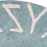 A round blue rug with the letters of the alphabet in white arranged around the edge. kids rugs singapore