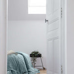 A round blue rug with the letters of the alphabet in white arranged around the edge. kids rugs singapore