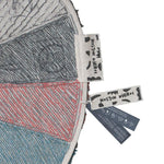 A round wool rug with a colorful pie chart design, featuring shades of green, blue, red, and gray, rainbow rug, kids rugs and carpets Singapore