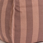 A round bean bag chair with pink and mauve vertical stripes, featuring a handle at the top for easy movement, kids bean bags and poufs in Singapore