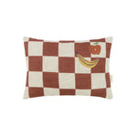 A rectangular linen cushion with a checkered pattern and fruit illustrations in maroon colour, available in Singapore