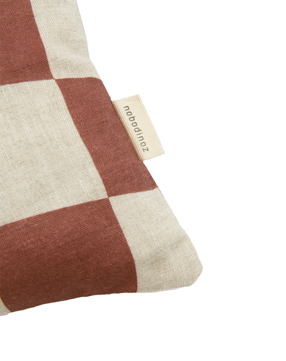 A rectangular linen cushion with a checkered pattern and fruit illustrations in maroon colour, available in Singapore