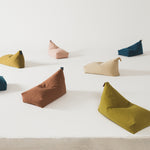 A brown quilted long beanbag with an embroidered handle, placed against a neutral background, kids bean bags and poufs in Singapore