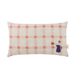 A rectangular linen cushion with a pink windowpane pattern and a graphic illustration of tulips in a purple vase on the lower right side. Available in Singapore
