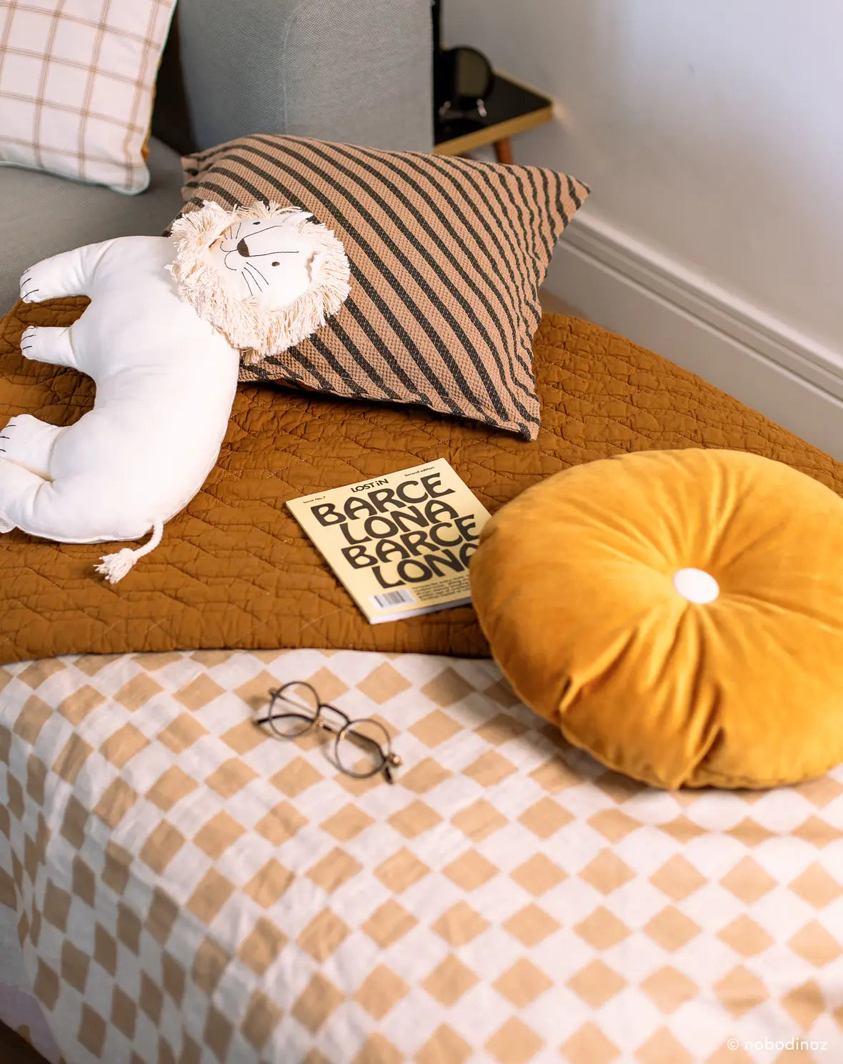 A round kids cushion with a yellow eco-velvet texture, available in Singapore