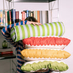 A cylindrical cushion with green and blue stripes, pop decor cushion, bold cushion, eclectic cushions, available in Singapore