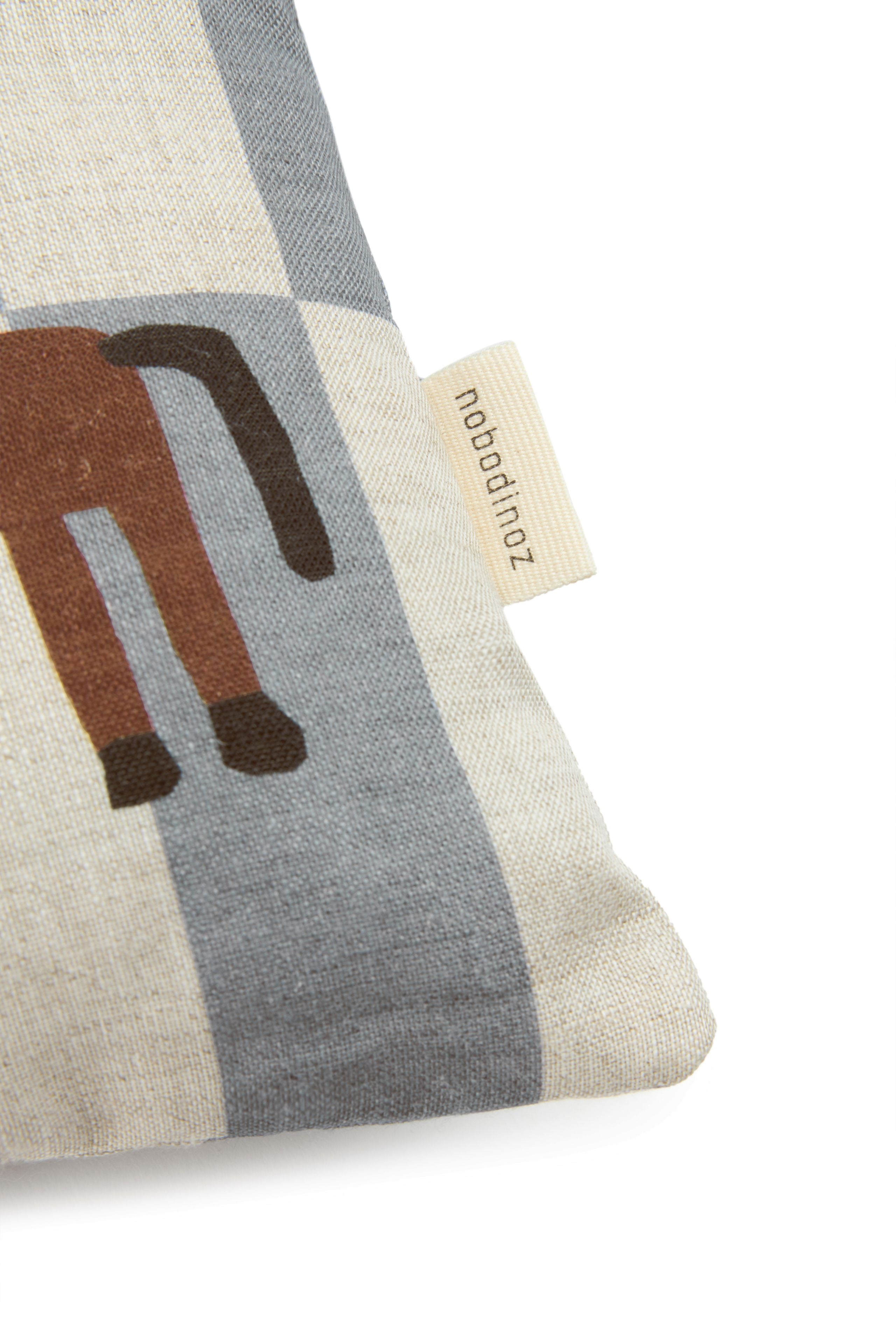 A rectangular linen cushion with a checkered blue and white pattern and a small horse illustration on the lower right side. Kids cushion, available in Singapore