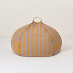 A round bean bag chair with lilac and yellow vertical stripes, featuring a handle for easy movement, bold home decor singapore, colourful home decor, kids bean bags and poufs singapore