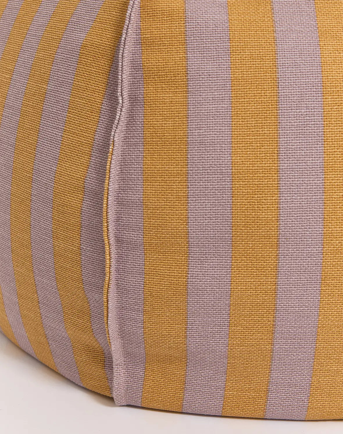 A round bean bag chair with lilac and yellow vertical stripes, featuring a handle for easy movement, bold home decor singapore, colourful home decor, kids bean bags and poufs singapore