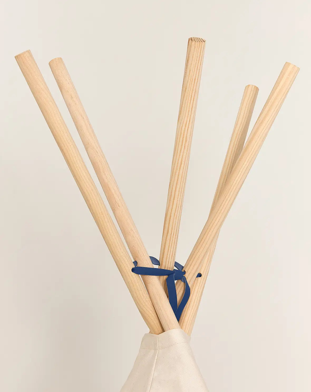 A blue and white Nobodinoz Vibes Tipi Arizona play tent made of organic cotton with wooden sticks, designed for children's indoor play, kids tipi tent, children tipi tent, available in Singapore