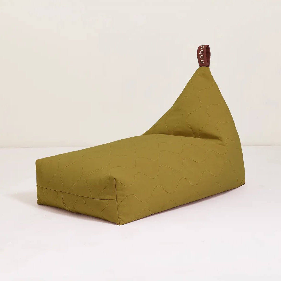 A green quilted long beanbag with an embroidered handle, kids bean bags and poufs Singapore