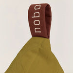 A green quilted long beanbag with an embroidered handle, kids bean bags and poufs Singapore