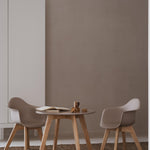 A round play table with a gray tabletop and wooden legs, designed for children.