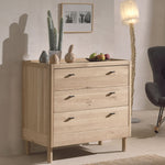 A three-drawer chest made of oak wood, with a natural wood finish and metal handles. available in singapore