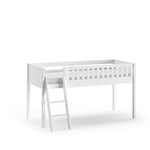 A white loft bed made of solid Scandinavian pine wood with a ladder on the side. Available in Singapore