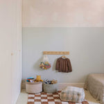 A rectangular rug with a traditional checkerboard pattern in toffee and cream colors, checkered rug, kids rug singapore