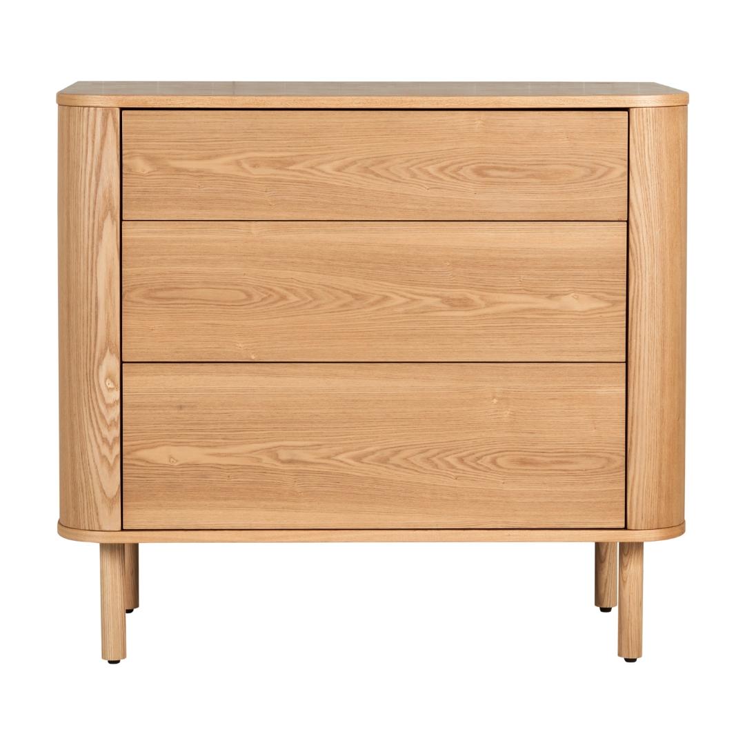A natural ash wood chest with three drawers, featuring a soft, rounded design and a warm wood finish.