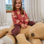A plush toy resembling a sleepy bear with soft fur in honey-coloured tones, featuring a zipper on its bottom for removing the inner filler, kids bean bags and poufs Singapore, lorena canals singapore