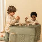 A sleepover mattress bean bag in olive green and a folded beige mattress, both made of eco-velvet. convertible mattress to pouf, kids bean bags and poufs Singapore