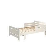 A white transformable bed with a mattress, designed to adjust in length. Available in Singapore, kids bed singapore, kids toddler bed singapore