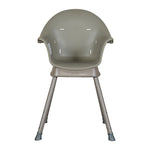 A Quax Ultimo High Chair in stone color with a modern design, featuring a high seat and adjustable legs, suitable for babies and toddlers.