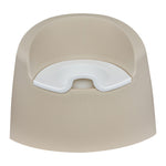 A beige Quax potty with a white inner bowl and high backrest, designed for toddlers.